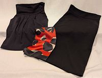 Overview of both skirts and scarf laid flat