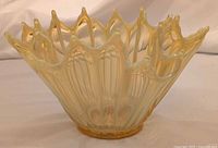 Oblique view showing exterior ruffled rim and overall form