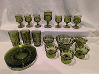 Full lot layout showing all 20 olive-green glass pieces