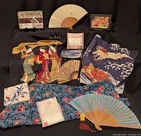 Overview of all items: three fans, multiple scarves and wraps, obi pouch, makeup pouch, handkerchief
