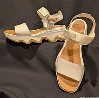 Top and side view showing pair of white Y-strap wedge sandals