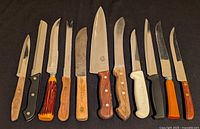 Front view of all eleven knives laid out
