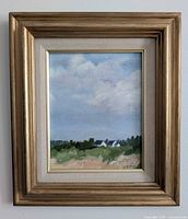 Frontal view of framed painting showing artwork, mat and frame