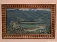 Frontal view of framed mountain landscape painting