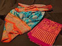 Both fabric pieces folded, showing colours and relative sizes