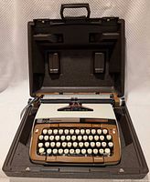 Typewriter inside open carrying case