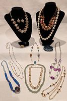 Group shot showing all necklaces, bracelet and arrangement