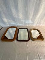 All three mirrors side by side showing relative sizes and frame styles