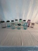 Group shot of all coloured preservative jars on table