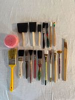selection of assorted brushes, foam applicators and sponge laid out