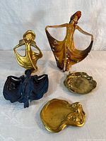Overview of all four items: two figurines and two dishes