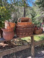 Group shot of assorted baskets on railing
