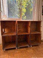 Front view of six-box shelving unit on wheels