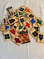 Spread of vintage button cards in various colors
