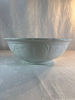 Side view showing embossed pattern and overall shape