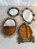 Group shot of all four mirrors showing sizes and materials