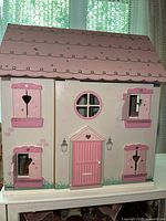front view of painted dollhouse exterior