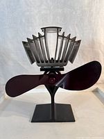 Front angle view showing blades, heat-sink fins and base