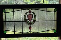 Front view of entire stained glass panel in frame