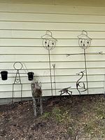 All four pieces leaned on exterior wall