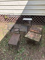 Group shot of all six metal tables outdoors