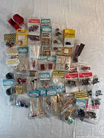 Spread of sealed miniature packages arranged on table