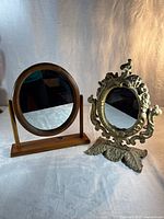 Front view of both mirrors showing design, size comparison