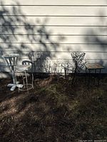 All eight plant stands lined up against wall