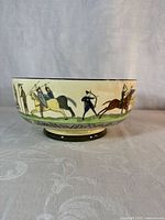 Side view of bowl showing mounted soldiers and archers motif
