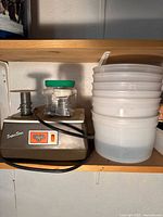 Glastar grinder with solder spools and stacked storage tubs