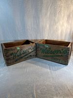 Both Wilson's crates side by side showing branding and overall condition