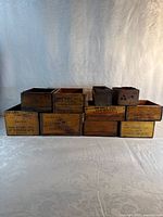 Front view of all ten crates showing stencilled sides