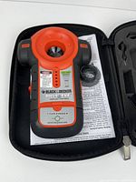 Stud finder in case with accessories visible