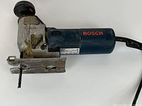 Full view of Bosch 1584AVS jigsaw showing body, shoe, blade and cord