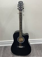 Full view of Chelldee black acoustic guitar front