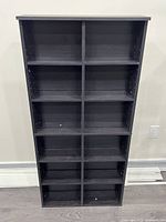 Front view showing eight compartments and adjustable shelf holes