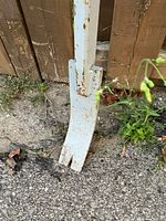 Close-up of forked claw tip showing paint wear and rust