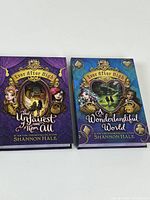 Front covers of both Ever After High novels
