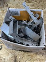 Full box of galvanized steel deck fasteners