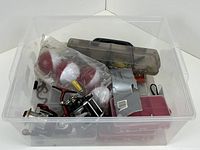 Overall view of lot inside clear bin