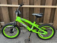 Full left side view of bright green Schwinn Koen 14" children's bike