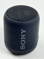 Front view of Sony SRS-XB12 speaker showing grille and logo