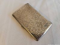 Top view showing full chased scroll pattern and overall condition