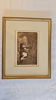 Framed etching showing overall frame and mat