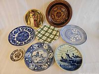 All eight decorative plates arranged together