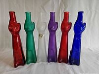 Front view of all six colored cat bottles