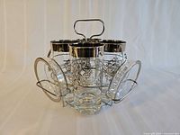 Glasses and coasters arranged in chrome caddy