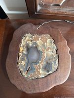 Front view of geode sun catcher in walnut frame