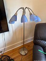 Full view of brushed nickel floor lamp with five blue shades