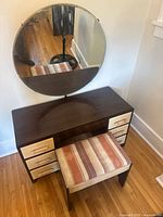 Front view of Gibbard vanity with round mirror and stool